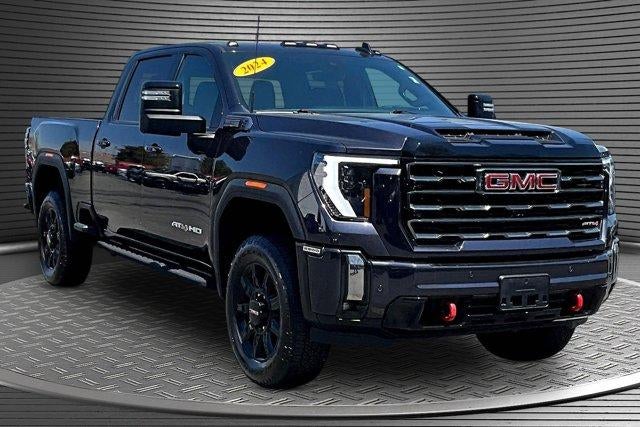 2024 GMC Sierra 2500 HD AT4 in Titanium Rush Metallic — front three-quarter view